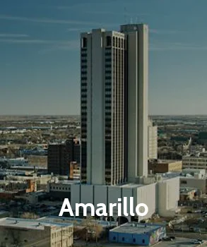 Amarillo cityscape with office buildings and expansive Texas plains, highlighting the growing property values and the importance of managing high tax assessments in this expanding region.