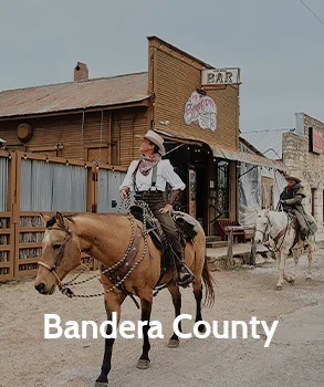 Historic cowboy scene in Bandera County, showcasing the county’s Western heritage and natural beauty.