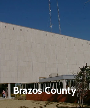 Brazos County courthouse with modern architectural design, featuring clean lines and prominent lettering, representing Brazos County's governmental and legal services.
