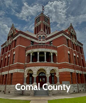 The grand Comal County courthouse with historic architecture, representing the county's legal and governmental importance.