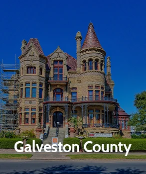 Galveston County's historic courthouse, known for its beautiful stonework and turrets, standing as a key landmark in the county.
