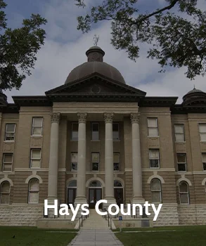Hays County courthouse with a grand dome and columns, showcasing neoclassical architecture and representing Hays County's legal and governmental center.