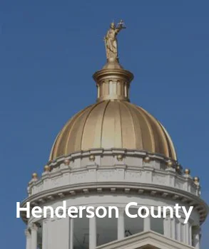 Henderson County courthouse with a beautiful dome and classic design, symbolizing the county’s legal authority and history.
