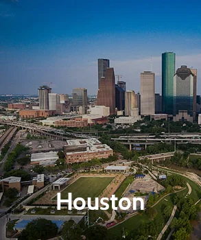 Houston city skyline with modern skyscrapers and residential neighborhoods, reflecting the growth of real estate and the need for property tax solutions in a rapidly developing urban landscape.