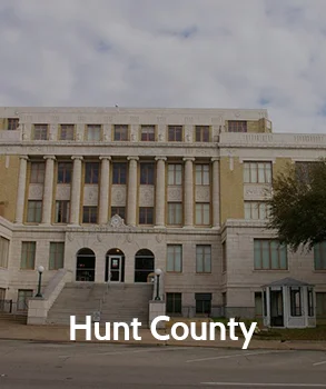 Hunt County courthouse with neoclassical architecture and grand staircases, representing Hunt County’s legal and governmental services.