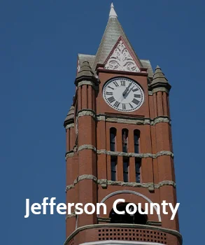 Close-up of the clock tower in Jefferson County with its distinctive red brick architecture, symbolizing Jefferson County’s historical landmarks.