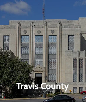 Travis County courthouse with its sleek, modern architectural style, representing Travis County’s legal and administrative center.