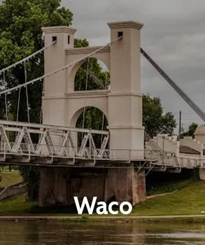 Waco’s iconic suspension bridge over the Brazos River, symbolizing the city’s rich history and the potential impact of increasing property taxes on local residents.