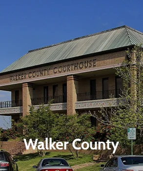 Walker County courthouse with brick exterior and large front balcony, representing Walker County’s historic architecture and government offices.