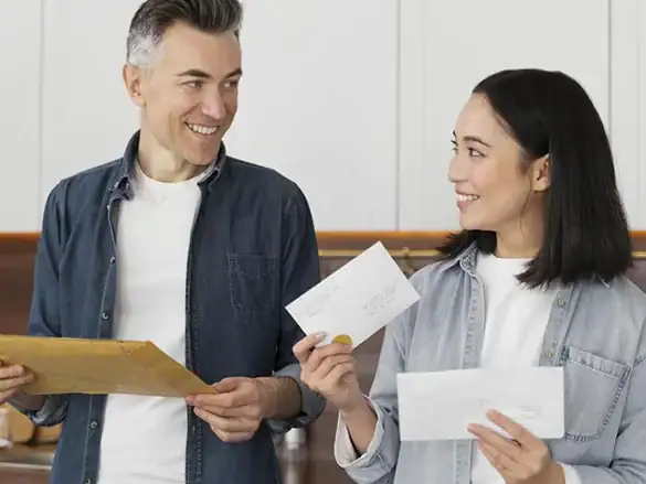 Happy homeowners in Fort Bend County receiving property tax protest results, showcasing the benefit of professional services like Tax Cutter that help reduce tax liabilities.