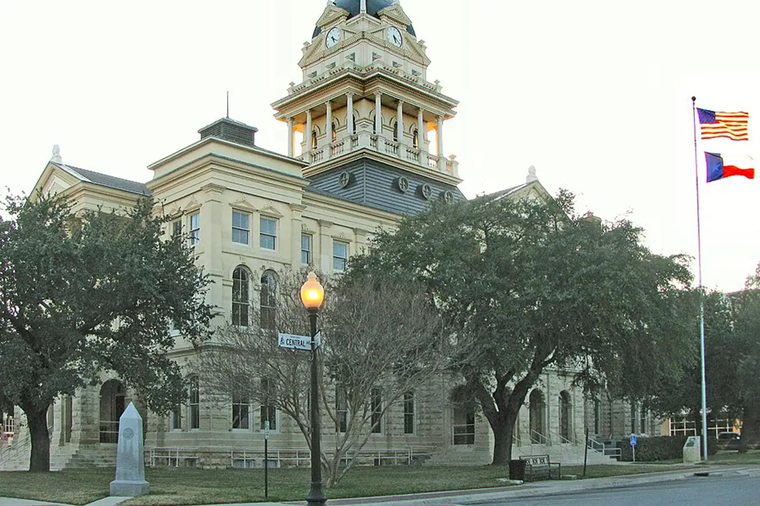 Bell County Courthouse in Texas with historic stone architecture, representing local property tax protest and appeal services by Tax Cutter.