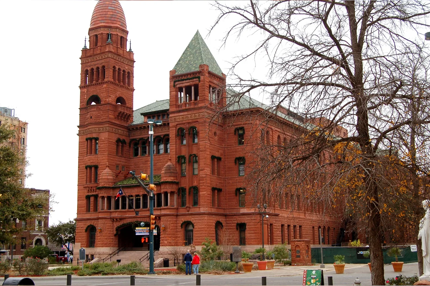 Bexar County Courthouse in San Antonio, Texas, historic red sandstone building representing local property tax protest services by Tax Cutter.